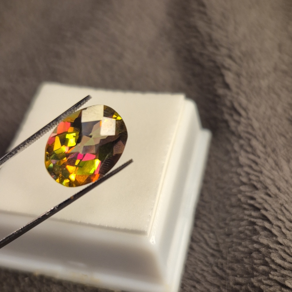 Topaz 5.5ct oval 14x10mm checkered cut